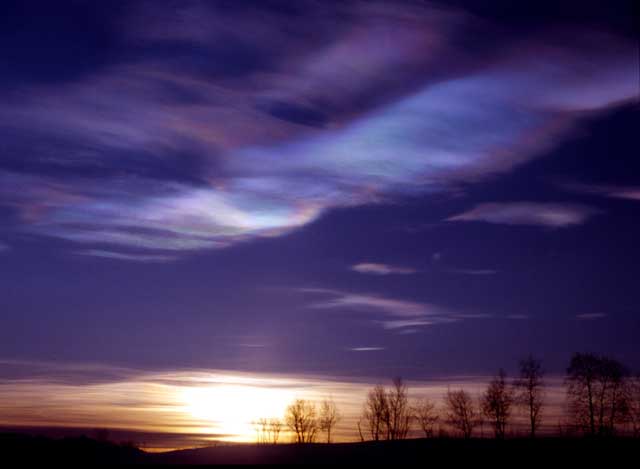 Nacreous polar stratospheric clouds showing pearl-like iridescent colours in a polar twilight sky