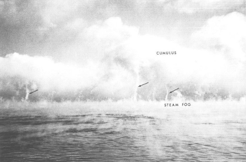 Steam devils and steam fog rising from warm water on a cold morning