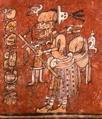 Maya painted pottery detail on a red ground showing a skeletal death god with visible ribs and a skull head, framed by glyph blocks