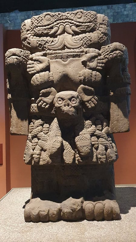 The colossal carved basalt monolith of Coatlicue, headed by two facing serpents and wearing a skirt of woven snakes