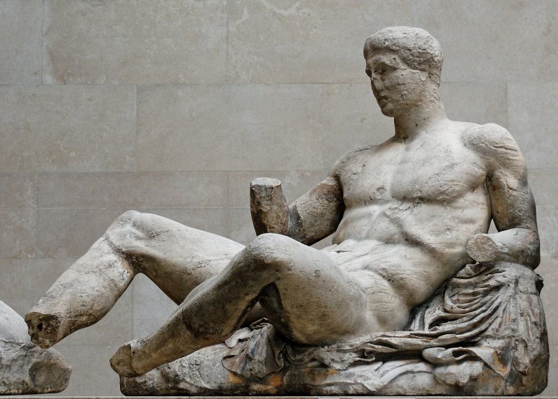 Reclining nude marble figure of Dionysos from the Parthenon pediment, forearms and lower leg missing