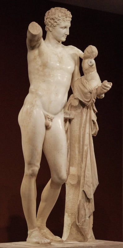 Marble Hermes leaning on a tree trunk, holding the infant Dionysus on his left arm