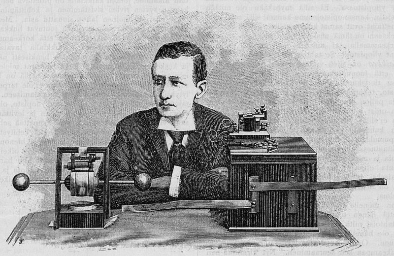 Wood engraving of a young Marconi seated with arms folded beside a spark-gap apparatus with two metal spheres on a rod and a wooden instrument case