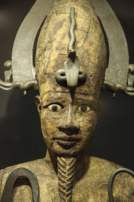 Gilded head and shoulders of Osiris wearing the tall plumed atef crown, with pale inlaid eyes