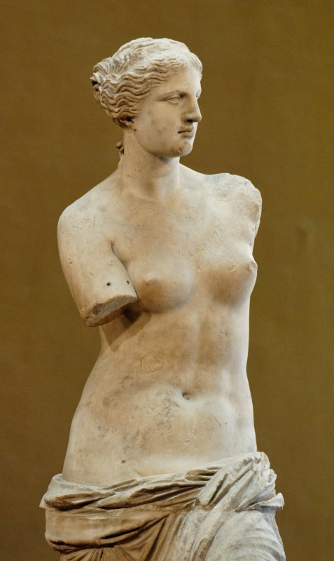 Marble Aphrodite of Melos with both arms broken away and drapery slipping from her hips