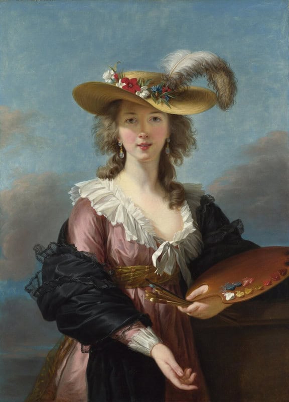 Young woman outdoors under a cloudy blue sky in a wide straw hat trimmed with a white plume and flowers, wearing a rose-pink gown with a white fichu at the neckline and a dark wrap gathered around one arm, holding a palette and brushes