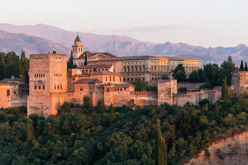 The Alhambra in Granada at dawn with the Sierra Nevada behind