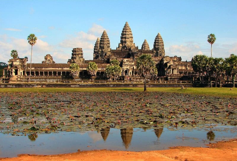 Angkor Wat reflected in the water in front of its five towers