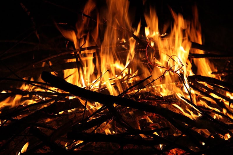 Flames of a wood campfire burning at night