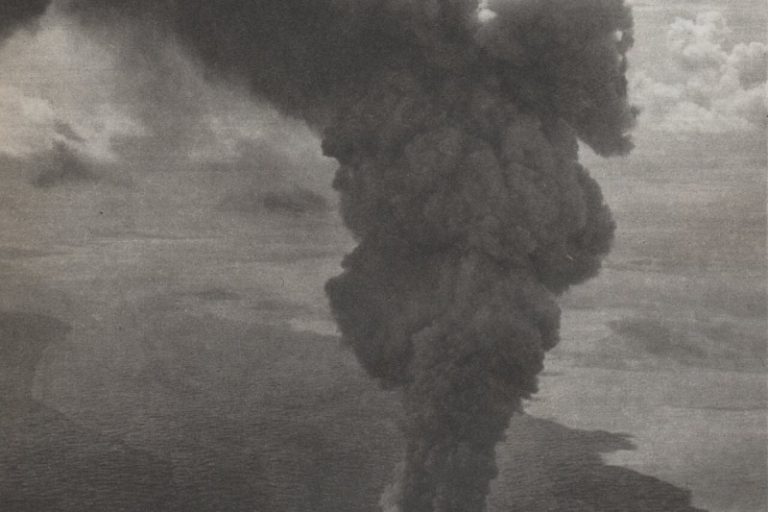 Grey eruption column of the Myojin-sho submarine volcano rising from the sea south of Tokyo in September 1952