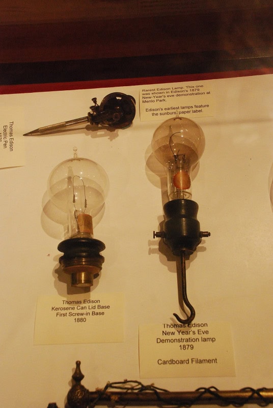 Two early Edison incandescent light bulbs of 1879 and 1880 in a museum display