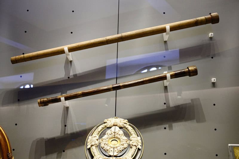 Two of Galileo's telescopes and an objective lens displayed at the Museo Galileo in Florence