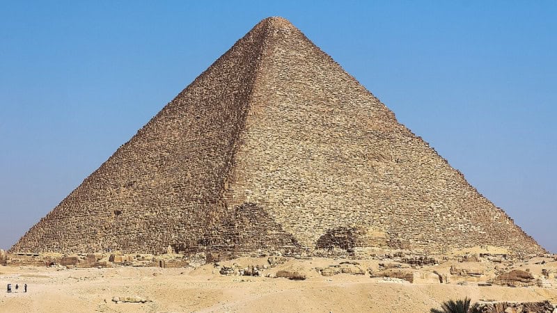 The Great Pyramid of Giza under a clear sky, seen from the desert