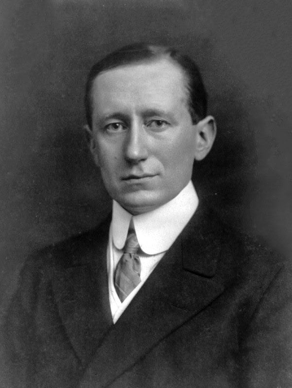Studio portrait photograph of Guglielmo Marconi in a suit, 1908