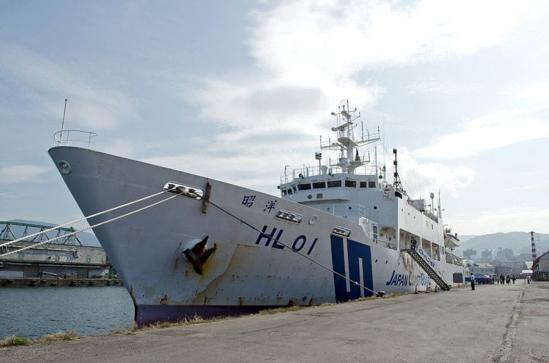 The white-hulled Japan Coast Guard survey vessel Shoyo, hull number HL01, moored alongside a quay