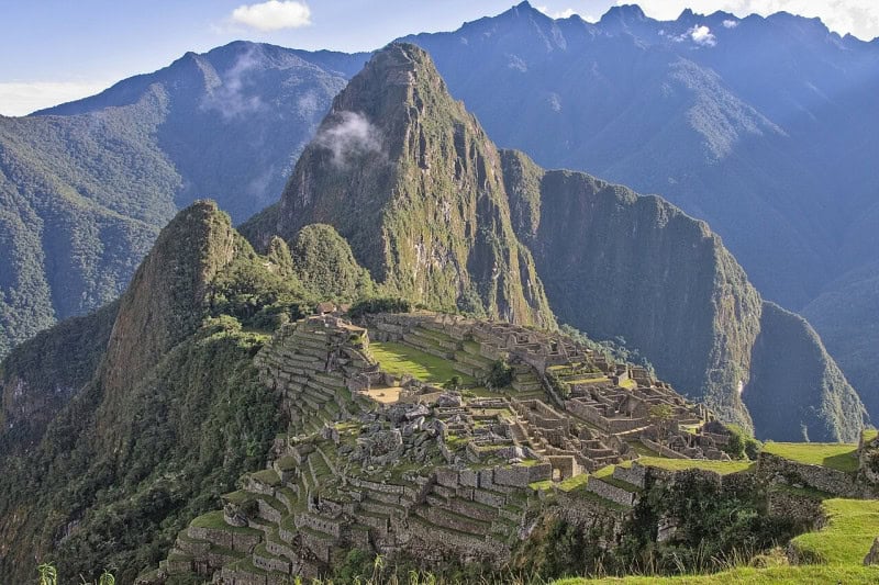 The terraces and stone buildings of Machu Picchu with Huayna Picchu behind