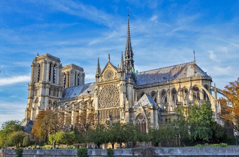 Notre-Dame de Paris from the river, with its two towers and spire, photographed in 2017