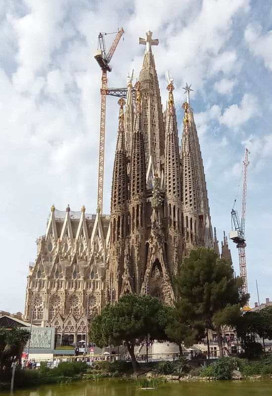 The spires of the Sagrada Familia in Barcelona under construction, with cranes