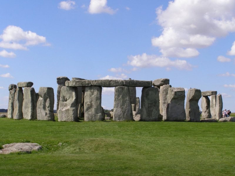 The sarsen circle of Stonehenge on Salisbury Plain under a cloudy sky